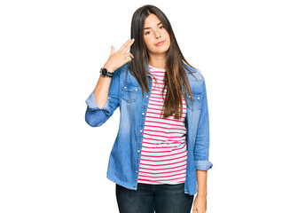 Sticker - Young brunette woman wearing casual clothes shooting and killing oneself pointing hand and fingers to head like gun, suicide gesture.