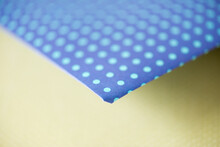 Cyan Polka Dots On Blue Scrapbooking Paper Photographed Using A Macro Lens, Featuring A Shallow Depth Of Field