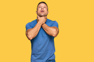 Wall Mural - Handsome muscle man wearing casual clothes shouting and suffocate because painful strangle. health problem. asphyxiate and suicide concept.