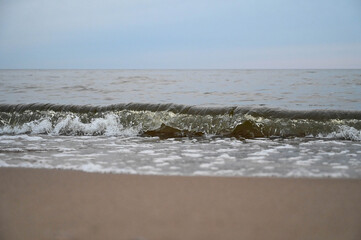 Close-up of water wave splashes by the sea