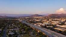 Aerial Sunset View Of The Residential And Industrial Areas Of Riverside, California.