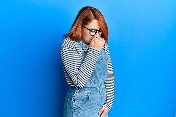 Poster - Beautiful redhead woman wearing casual clothes and glasses feeling unwell and coughing as symptom for cold or bronchitis. health care concept.