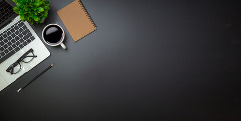 Workspace - Flat top view illustration of a workspace with a coffee cup and notebook on the black desk surface,Office desk concept.