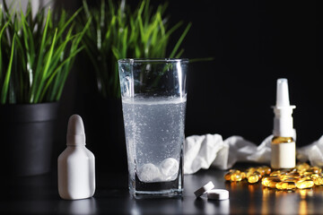 Wall Mural - Composition from Bottles of cough syrup.Healthcare, medicine, flu and treatment concept - paper wipes and thermometer with pills.