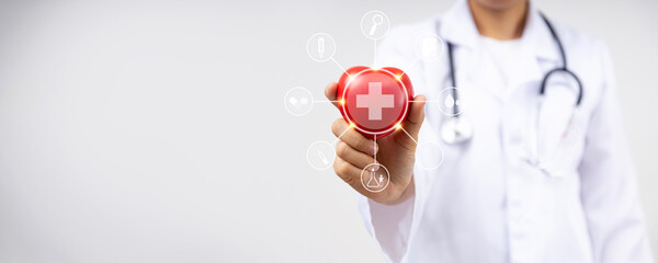 Close up hand of doctor holding red heart for heart disease for health insurance service  concept