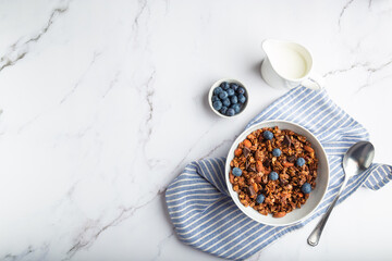 Wall Mural - Homemade granola, muesli with pieces of dark chocolate, nuts and blueberries