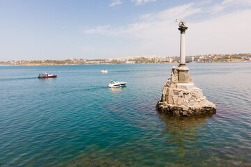 Wall Mural - Symbol of Sevastopol, monument column with eagle dedicated to navy in sunny summer day, aerial view