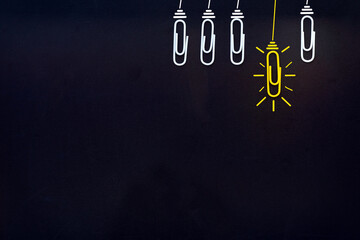 Paperclip idea Success concept Great Creative Ideas, Glowing light bulb (paperclip) on black clear background