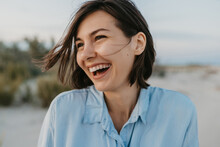 Smiling Portrait Of Candid Laughing Woman