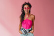 © mary_markevich - attractive black african american woman in stylish outfit on pink background