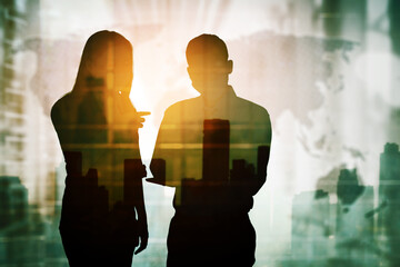 Double exposure of two business people discussing