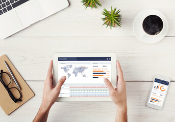 Aufkleber - Top view of man using digital tablet, smartphone in office