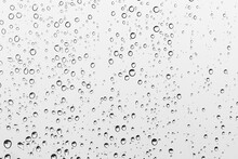 Water Drops On Transparent Gray Glass