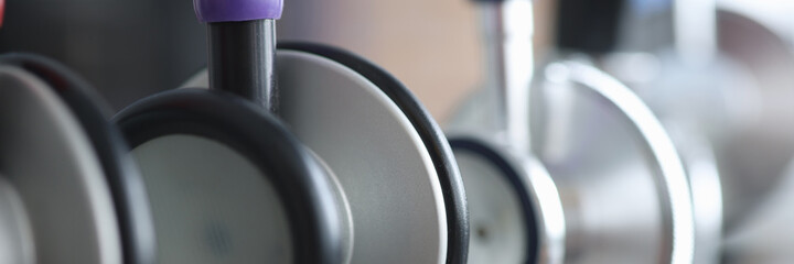 Closeup of many multicolored phonendoscopes in clinic