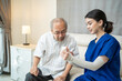 © Kawee - Asian female nurse explaining medicine instruction to senior patient.