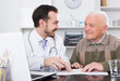 © JackF - Aged man visiting consultation with man doctor in hospital