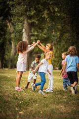 large group of school kids having fun in nature. happy school age.