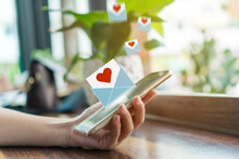 Hand Typing Love Letter Email In Smartphone Social Network Online Community  With Social Media Love Letter Mail Send Out Icons Valentine.