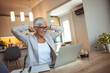 © Dragana Gordic - Shot of a contented mature businesswoman taking a break at work and leaning back with her hands behind her head. Shot of a mature businesswoman sitting in a chair and stretching in a modern office