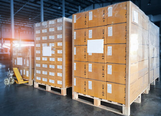 Wall Mural - Interior of Storage Warehouse. Stacked of Package Boxes Wrapped Plastic Flim on pallet rack. L-Shape Pallet Corrugated Paper Cardboard Angle Corner Edge Protector. Shipping Warehouse Logistics.	
