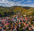 Tokaj, Hungary - Aerial view of the town of Tokaj on a sunny autumn morning with blue sky and clouds. Heart of Jesus Church and the main square at center with the famous wineyards at background
