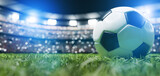 Fototapeta Sport - Football soccer ball on grass field on stadium