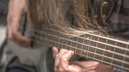 musician playing guitar, close up