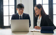 © bank215 - Asian businessman and his secretary woman working with laptop for strategy business plan