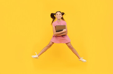 Wall Mural - happy kid girl jumping with laptop go online shopping, discount