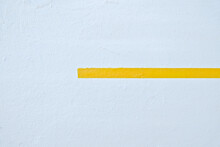 A Thick Yellow Line On A White Background.