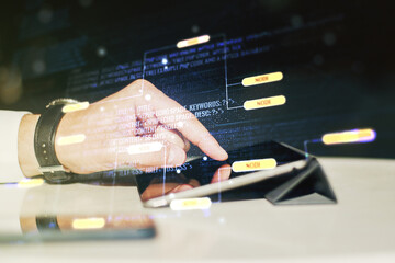 Poster - Double exposure of abstract creative programming illustration and finger clicks on a digital tablet on background, big data and blockchain concept