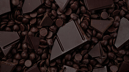 Wall Mural - broken dark chocolate bar and chocolate chips top view, rotation