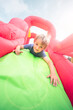 © Brian Jackson - Child on inflatable bouncy castle slide