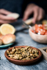 Wall Mural - plate of fried mushrooms on a table