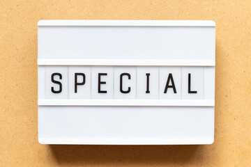 Poster - Lightbox with word special on wood background