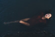 © BullRun - Relaxed lady lying in water