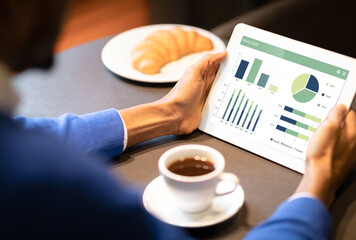 Aufkleber - Unrecognizable black businessman analysing market on digital tablet
