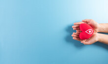 Medical And Donor Concepts. Hand Holding A Handmade Red Heart With A Sign Or Symbol Of Blood Donation For World Blood Donor Day.