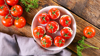 Wall Mural - cherry tomato garnished with cream cheese