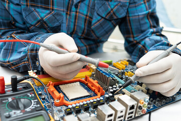 technician repairing inside of hard disk by soldering iron. Integrated Circuit. the concept of data, hardware, technician and technology.