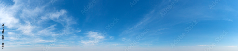Blue Sky background with tiny Clouds. Panorama background - obrazy, fototapety, plakaty 
