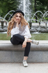 Wall Mural - nice woman student sitting outdoors