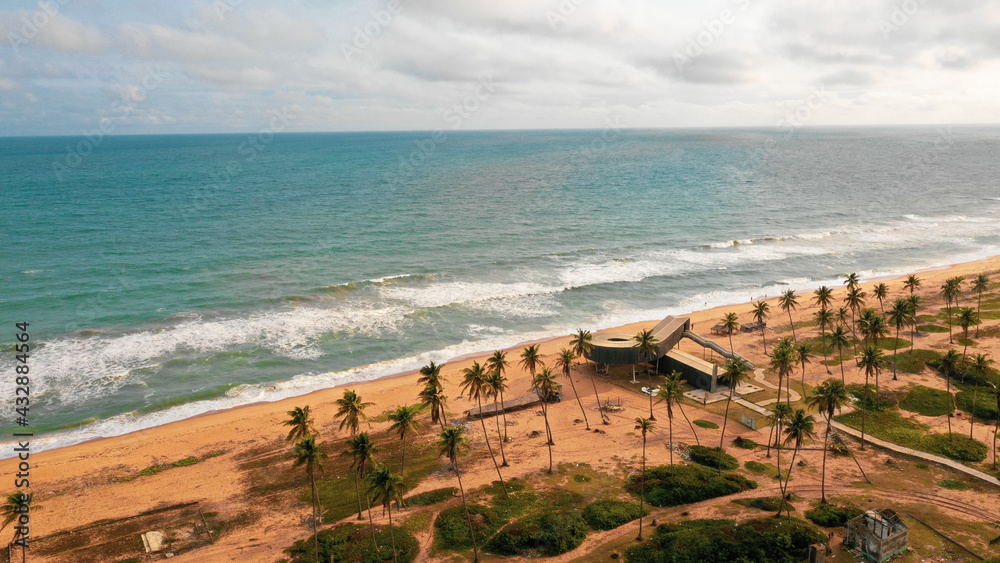 Aerial shot of the shore by the Atlantic Ocean captured in Badagry, Lagos State, Nigeria - obrazy, fototapety, plakaty 