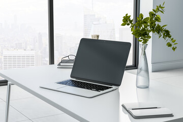 Poster - Monochrome style work place with black laptop monitor with copyspace on marble tabletop, glass vase with plant and city view from big window. 3D rendering, mock up