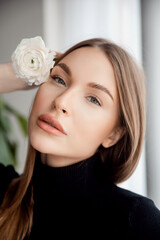 caucasian fashion portrait of beautiful young woman with green eyes white background. concept beauty