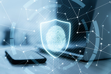 Poster - Cyber safety and protection concept with digital glowing fingerprint in shield on laptop with smartphone background. Double exposure.