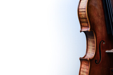 Sticker - Closeup shot of a beautiful and handmade violin on a white background