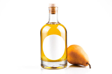 Fresh pear and bottle with fruit brandy. Bottle with oval label, amber liquid and pear isolated on white background. Homemade fruit alcohol concept.