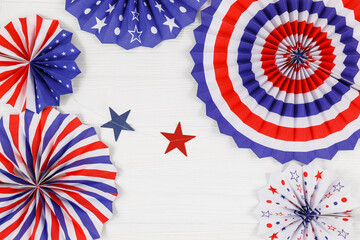 Wall Mural - Decorations for 4th of July day of American independence, flag,  straws, paper fans. USA holiday decorations on a white wooden background, top view, flat lay	