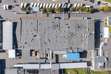 Wall Mural - aerial top view of the industrial zone with warehouses and parked trucks